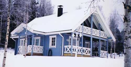 A Scandinavian log cabin in the snow