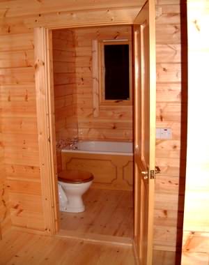 Avoid too much exposed timber in log cabin wet areas Avoid too much exposed timber in log cabin wet areas