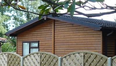 Many mobile log cabins holiday chalets have plastic, fake wood exteriors Many mobile log cabins holiday chalets have plastic, fake wood exteriors