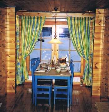 A log cabin interior is very inviting with the cold snow outside!