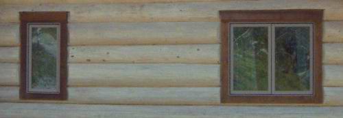 Windows in a hand scribed North American log cabin