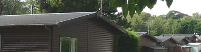 Mobile log cabins roofs are low pitch to keep below height limit in Europe Mobile log cabins roofs are low pitch to keep below height limit in Europe